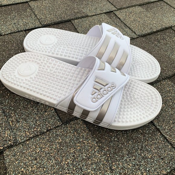 white and silver adidas slides